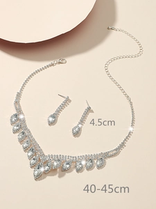 Detail showing 4.5cm crystal earrings and 40-45cm silver necklace set on beige base