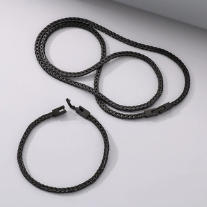 Detail of black stainless steel woven chain necklace and bracelet with box clasp