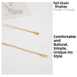 Macro shot of 18K gold necklace extension chain with lobster clasp and circular tag