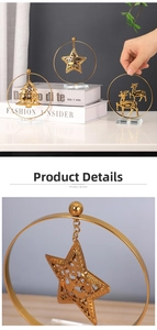 Detailed close-up of luxury gold metal Christmas tree and reindeer ornaments on crystal bases