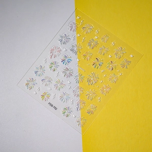 Detailed macro view of 5D embossed fireworks nail stickers with heart and star patterns