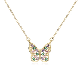 Macro view of gold-plated butterfly pendant with colorful zircon and pearl details