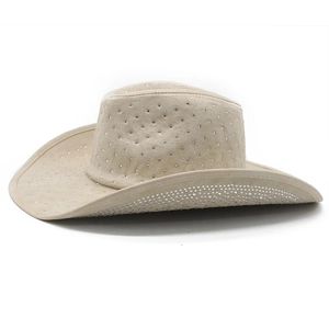 Close-up detail of shimmering silver rhinestones on beige suede Western cowboy hat