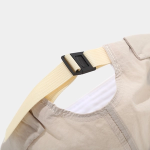 Detail of adjustable quick-dry skull cap strap with durable plastic buckle and stitching
