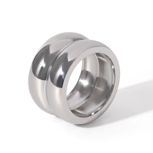 Macro shot of silver wide band ring featuring a double-layer arc design and mirror finish