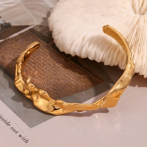 Minimalist 18K gold-plated stainless steel open cuff bracelet with wavy lava texture