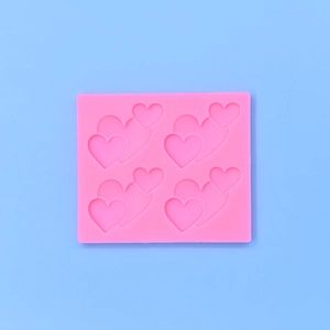 Stampo in silicone rosa con quattro cuori impilati per decorazione torte e candele DIY