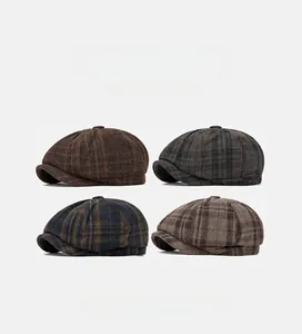 Collage of wool octagonal newsboy caps in four distinct British style plaid patterns