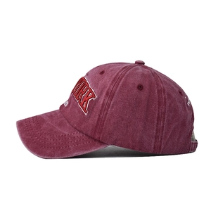 Detail of vintage washed burgundy cotton baseball cap with New York 1985 embroidery