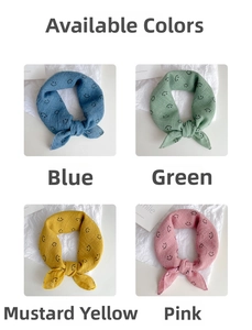 Detail of four colorful cotton scarves in blue, green, yellow and pink with smile patterns