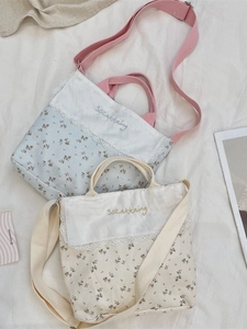 Floral canvas tote bags with delicate lace trim and adjustable straps for daily commute