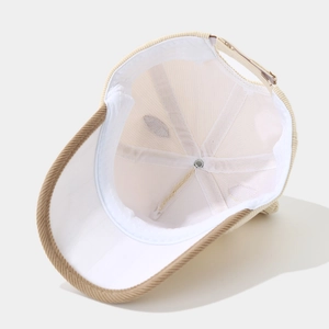 Detail of internal corduroy baseball cap stitching and adjustable metal buckle