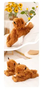 Close-up of fluffy ginger Highland cow plush toy showing long fur texture and horns