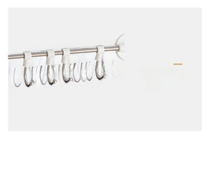 Detail showing adjustable hooks on a stainless steel rack for customized spacing