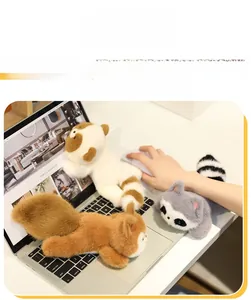 Plush raccoon and squirrel wrist rest for mouse support in a home office setup