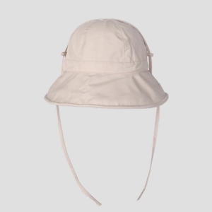 Detail of adjustable chin strap and wide brim on beige foldable sun protection bucket hat