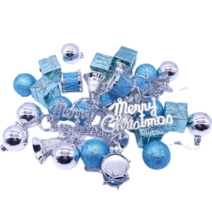 Blue and silver Christmas ornaments set with baubles, bells, and Merry Christmas signs
