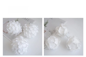 Macro detail of white petal-shaped Christmas foam balls with delicate layered textures