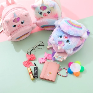 Detail of plush unicorn backpacks with sequined horns and soft rainbow texture