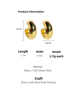 Detail view of chunky C-shaped gold earrings with measurements and material specs