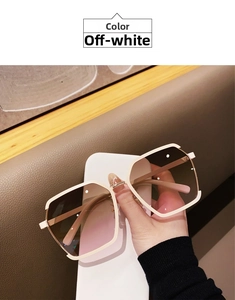 Detail showing oversized square beige frame with brown-to-pink gradient lenses