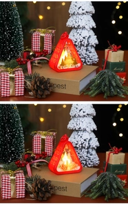 Detail of red Christmas lantern with LED light and Merry Christmas cutout patterns