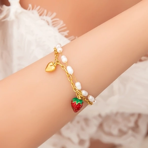 Handmade gold stainless steel bracelet with white pearls, heart and strawberry pendants