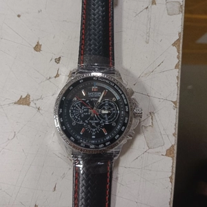 MEGIR sports watch for men featuring a black dial and red stitching on the leather strap