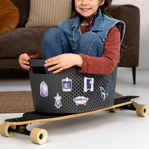 Dreamy magic graffiti stickers showing crystal and candle patterns on a storage basket