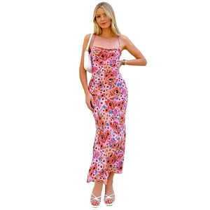Detail view of pink floral long dress with slim fit straps and vibrant botanical print