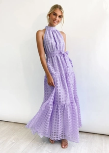 Close-up of lavender plaid tiered maxi dress with halter neckline and high-waist belt