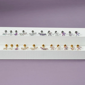 Detailed collection of curved opal labret studs with marquise zircon in gold and silver