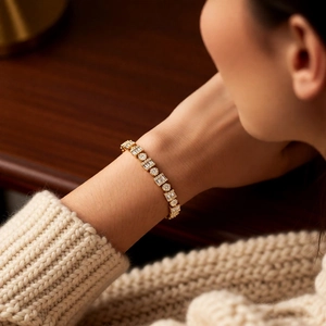 Detailed macro of 18k gold plated bracelet with alternating round and square crystals