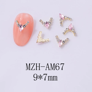 Detail of V-shaped pink diamond crown nail charms with size 9x7mm and gold base