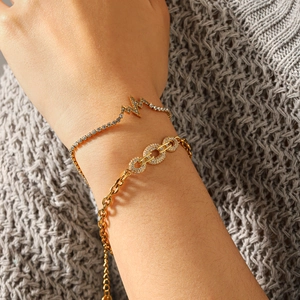 Minimalist gold stainless steel bracelets with micro-pave zircon on knit background