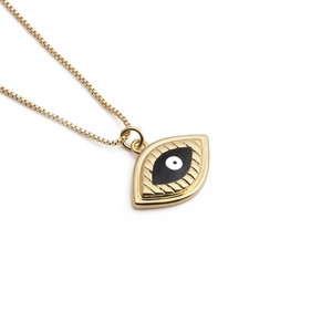 Vintage evil eye necklace with gold plating and zircon, centered on a white background