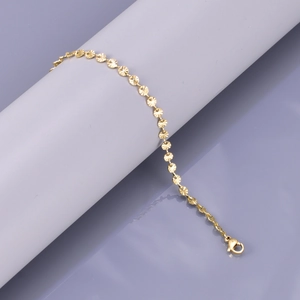 Detail showing 18K gold plated snowflake chain with sunburst patterns and lobster clasp