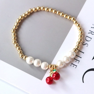 Gold-plated pearl bracelet with bright red cherry pendant for women and girls