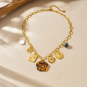 Vintage gold necklace with acrylic leopard flower, angel pendant and religious medal