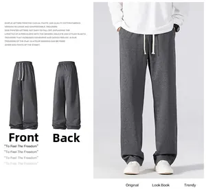 Detail view of men's grey casual pants featuring elastic waist with white drawstring