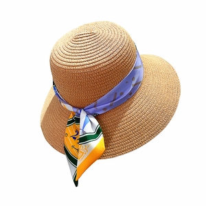 Women's summer straw hat with wide brim, lilac ribbon and colorful floral scarf detail