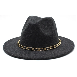 Detail of black wool fedora hat featuring a gold metal chain link band and felt texture