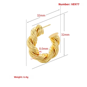 Detailed view of gold-plated twisted C-hoop earring with 32mm diameter and 8mm thickness
