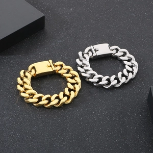 Detail of 20mm punk Cuban link bracelets in gold and silver finish with sturdy clasps