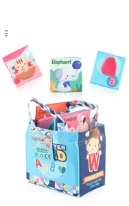 Detailed set of soft alphabet fabric cards with animal patterns and blue storage bag
