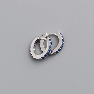 Detailed close-up of S925 sterling silver hoop earrings with micro-set blue cubic zirconia