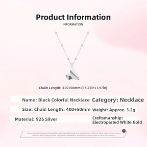Detail view of s925 sterling silver paper plane necklace with heart pendant