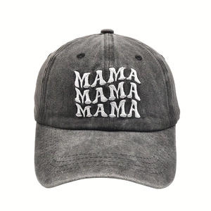 Close-up of triple MAMA embroidery on a vintage charcoal washed cotton baseball cap