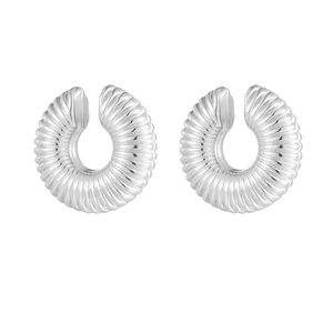 Detail of silver-tone hollow ear clips with unique spiral ribbed texture and C-shape design