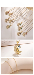 Detailed macro view of gold-plated bear and moon pendant with colorful zircon star stones